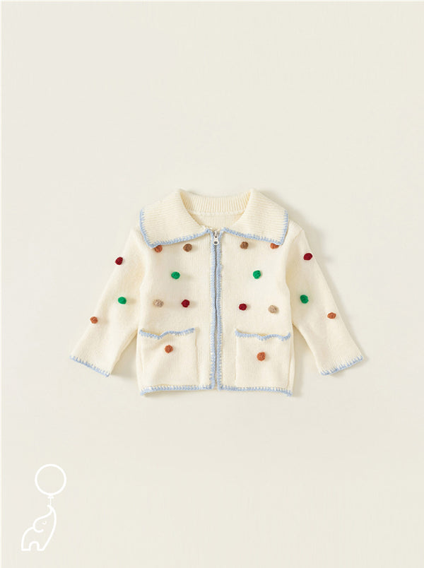 Ivory Cardigan with Sky Blue Trim and Colorful Pom Pom